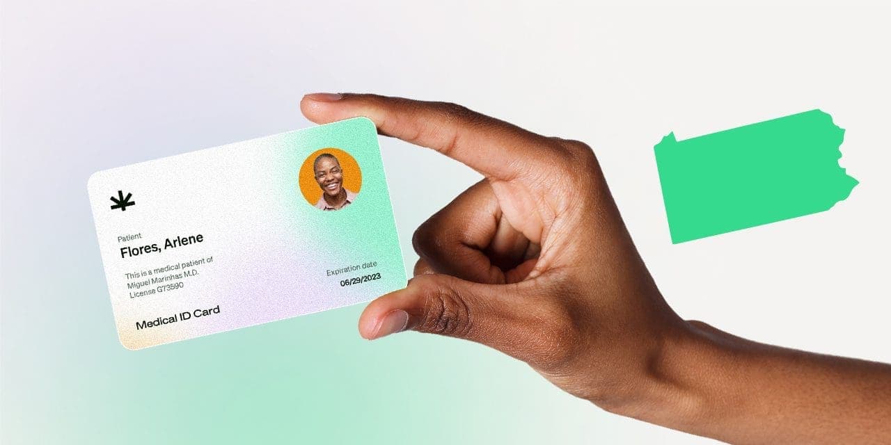 closeup hand holding MMJ card