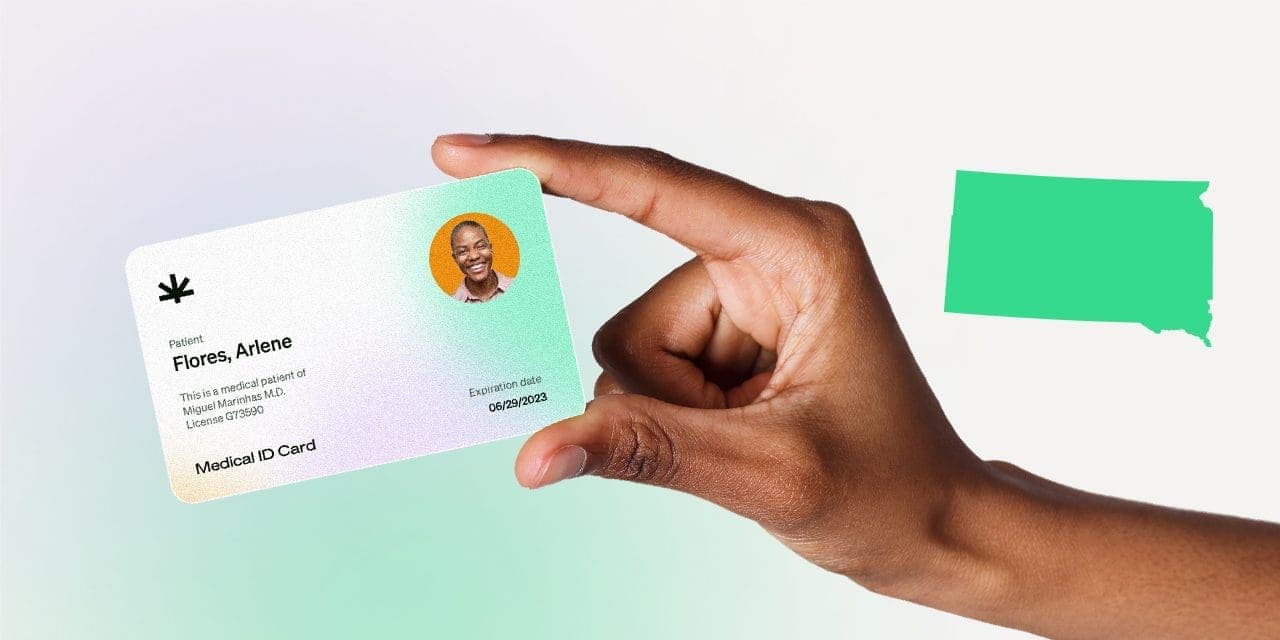 closeup hand holding MMJ card
