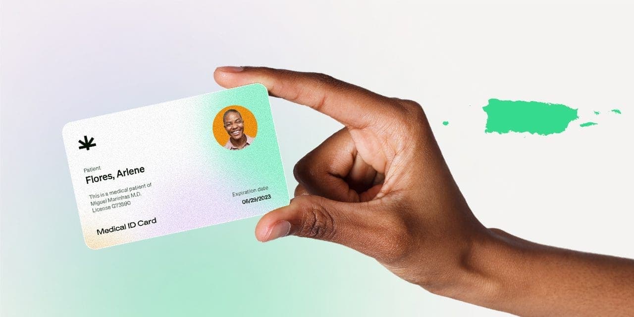 closeup hand holding MMJ card