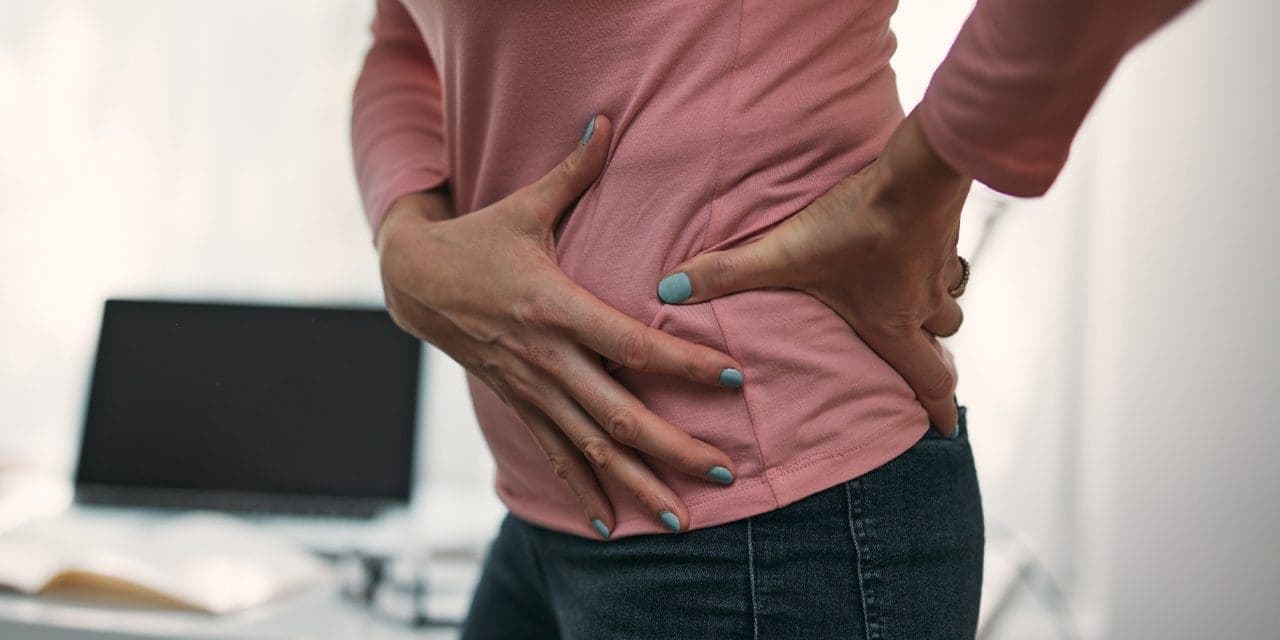 closeup photo of woman's side waist holding by both hands