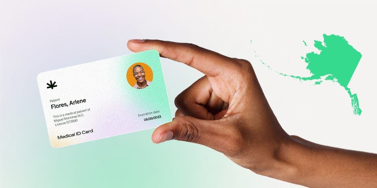 closeup hand holding MMJ card