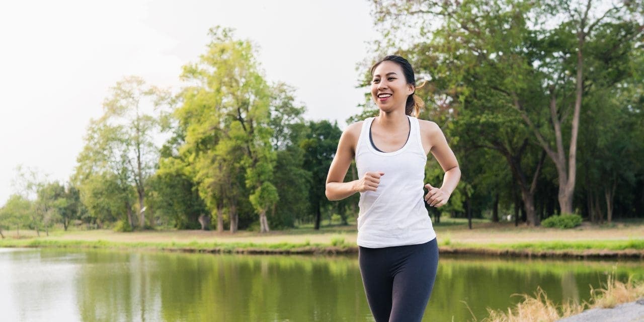 woman running in the lake park